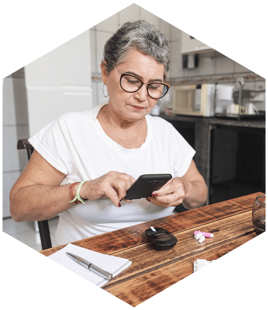 Older woman scheduling healthcare appointment on smartphone