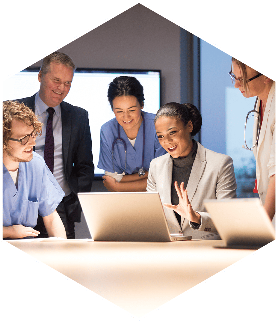 group of healthcare professionals looking at a master patient index on a laptop