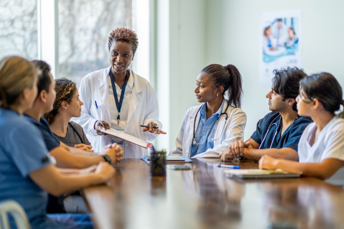 A clinical team collaborates to deliver coordinated care through healthcare interoperability.