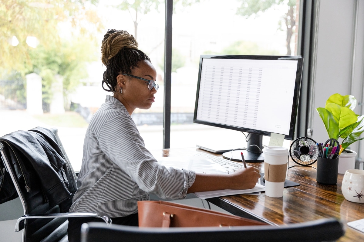 Administrator reviews provider data on a spreadsheet to help reduce claim denials.