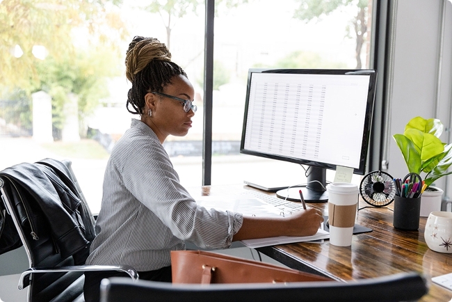 Administrator reviews provider data on a spreadsheet to help reduce claim denials.
