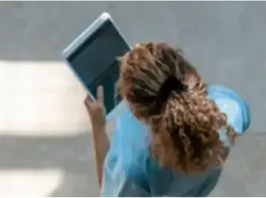 nurse-reviewing-data-on-tablet